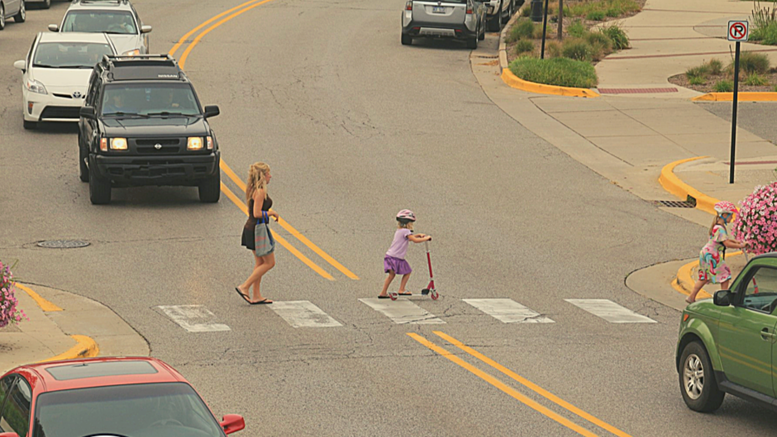 Three girls crossing street