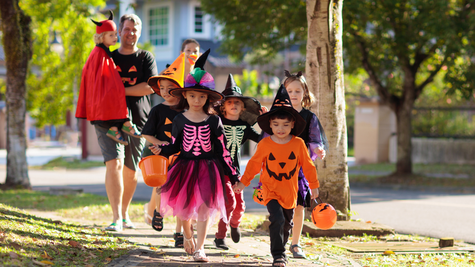 Parents and kids trick-or-treating