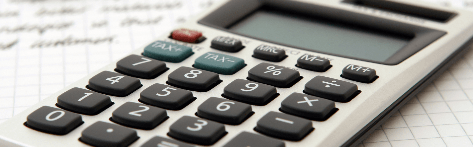 Calculator on top of a note pad