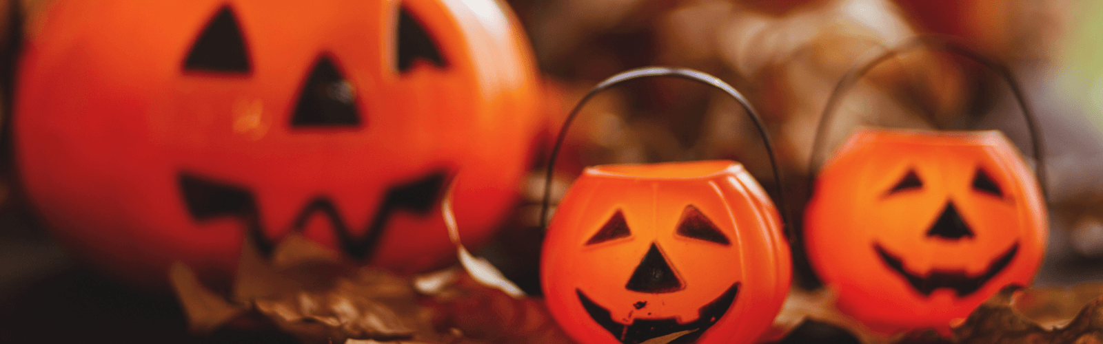 Three plastic pumpkin pails